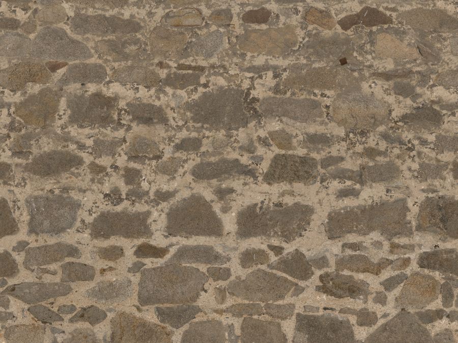 Grey stone wall laid with lime mortar